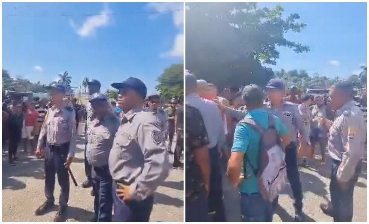 Policías intentando calmar la protesta en Santiago de Cuba. (Captura de pantalla © Mag Jorge Castro-Twitter)