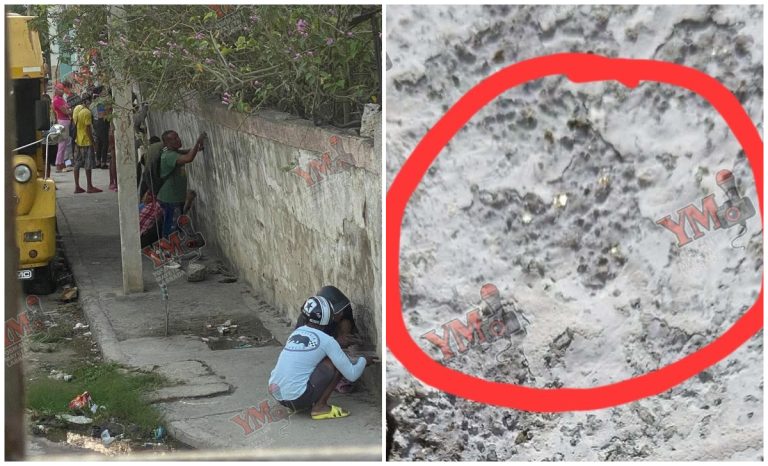 Vecinos raspan un muro en Santiago de Cuba para buscar… ¿Oro?